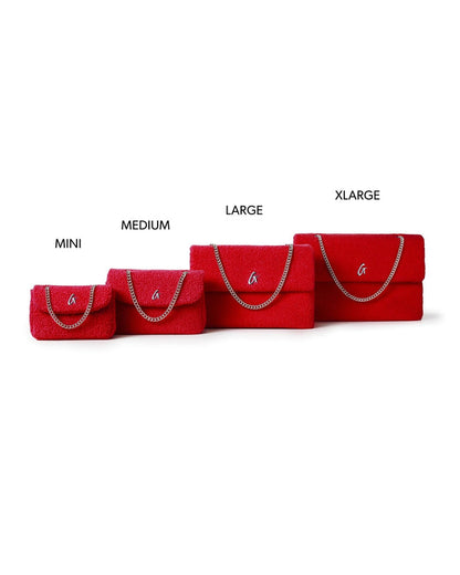 Large red teddy flap bag with a chain strap, showcasing a plush texture and stylish design for affordable luxury.