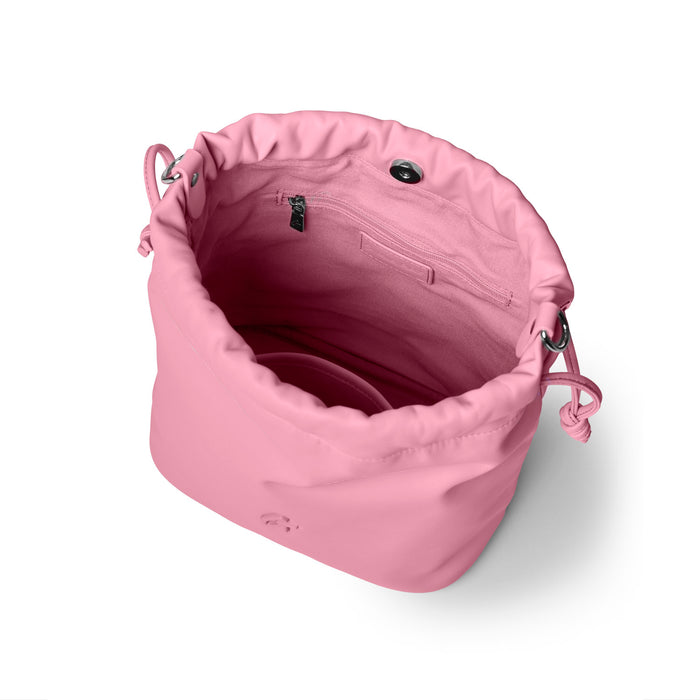 Soft pink medium drawstring bucket bag with a spacious interior and inner pocket for organization.