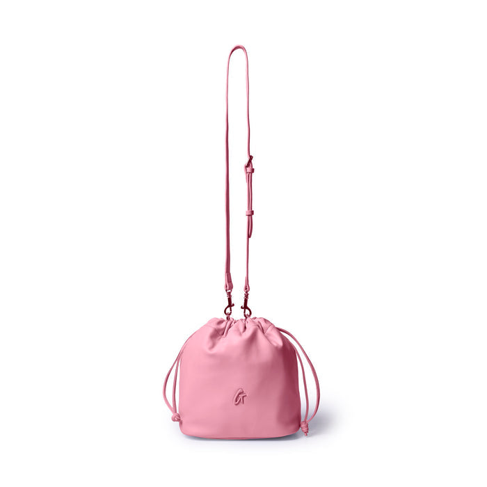 Soft pink medium drawstring bucket bag with adjustable strap, perfect for stylish and affordable luxury.