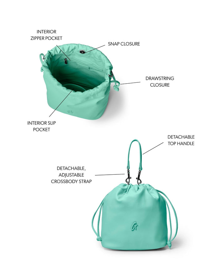 Teal medium drawstring bucket bag featuring a snap closure, interior pockets, and adjustable straps for versatile wear.