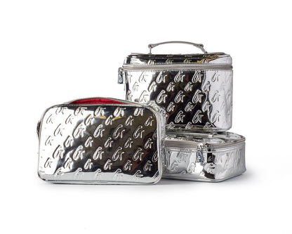 Medium metallic silver monogram toiletry bag set with embossed logo pattern, includes a large, small, and zippered pouch.