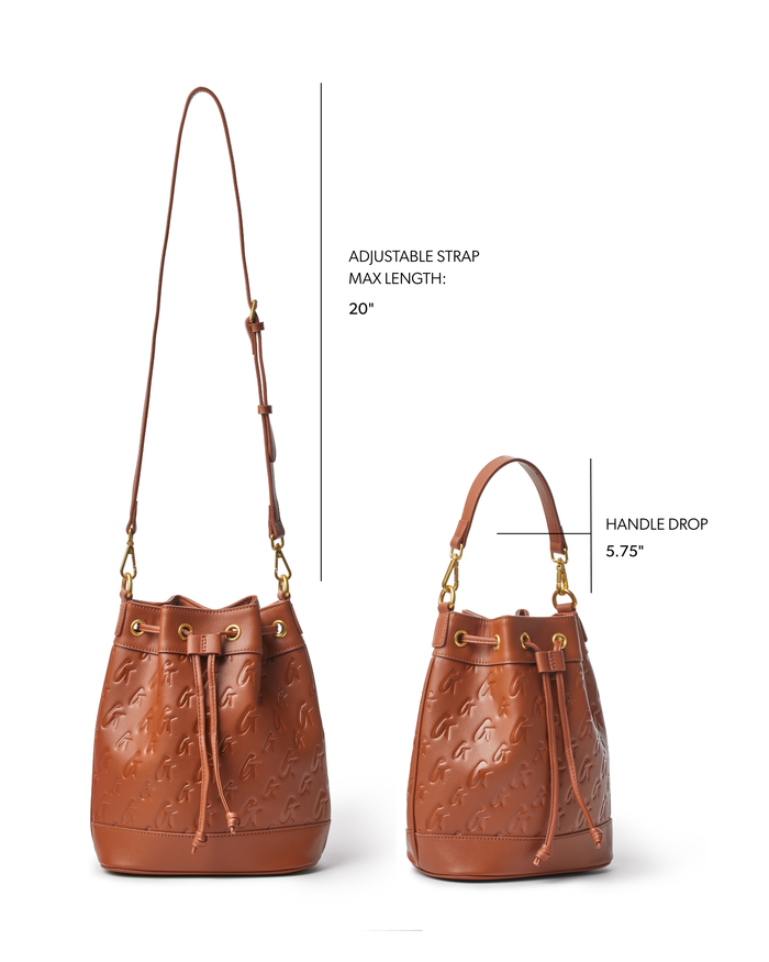 Medium brown monogram bucket bag featuring an adjustable strap and a stylish handle drop, perfect for everyday use.