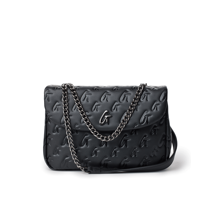 Black medium monogram flap bag with embossed logo pattern and a silver chain strap.