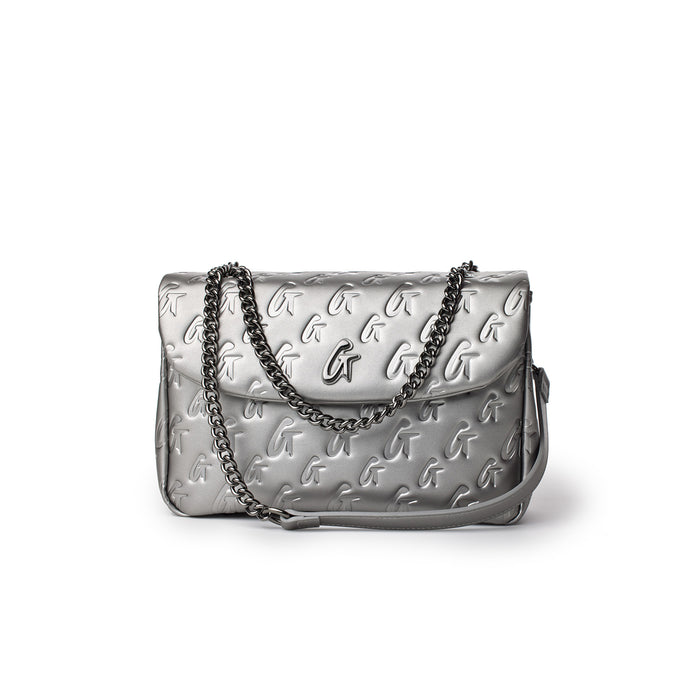 Medium platinum monogram flap bag with embossed G logo pattern and a silver chain strap.