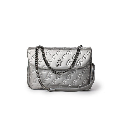 Medium platinum monogram flap bag with embossed G logo pattern and a silver chain strap.