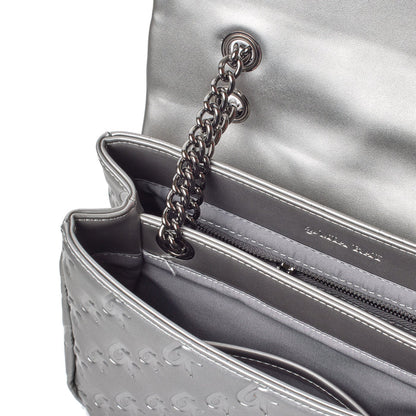 Silver medium monogram flap bag with a chain strap, interior zip pocket, and embossed logo detail.
