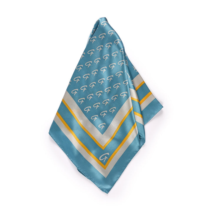 Medium silk scarf in blue and gold with a monogram pattern and striped border, elegant and luxurious accessory.