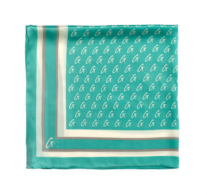 Teal medium silk scarf featuring a monogram pattern and elegant border, perfect for adding a touch of luxury.