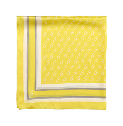 Medium yellow silk scarf featuring a monogram pattern and contrasting border, perfect for adding a touch of luxury.