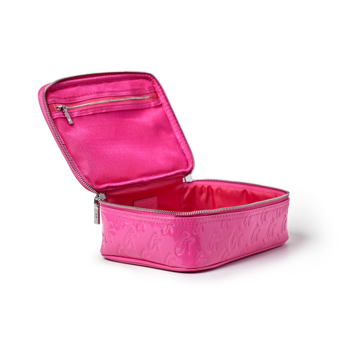 Pink medium monogram toiletry bag with a zipper closure, interior mesh pocket, and embossed monogram pattern.