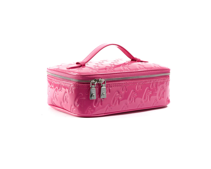 Pink glossy toiletry bag with embossed monogram pattern, silver zipper, and handle, designed for travel organization.