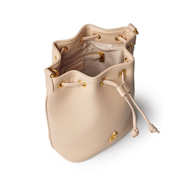 Medium nude pebble bucket bag with gold hardware, drawstring closure, and interior zip pocket.