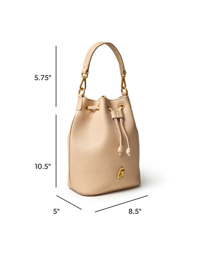 Medium pebble bucket bag in nude with gold accents, featuring a drawstring closure and a stylish silhouette.