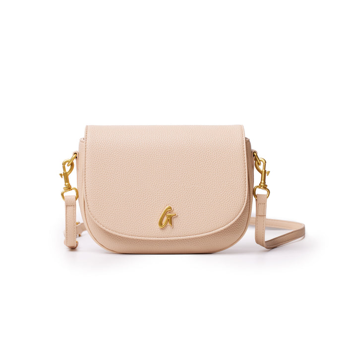 Medium pebble-textured shoulder bag in nude color with gold hardware and a detachable strap.