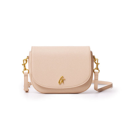 Medium pebble-textured shoulder bag in nude color with gold hardware and a detachable strap.