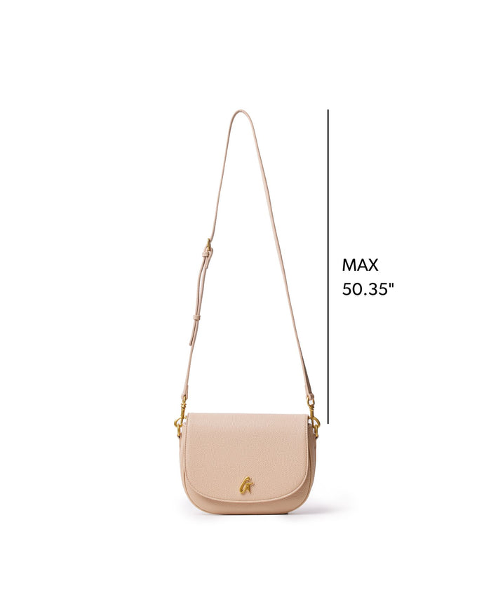 Medium pebble shoulder bag in nude with adjustable strap, featuring a sleek design and gold accents. Perfect for everyday use.