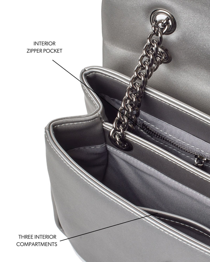 Medium standard flap bag in platinum featuring an interior zipper pocket and three spacious compartments.