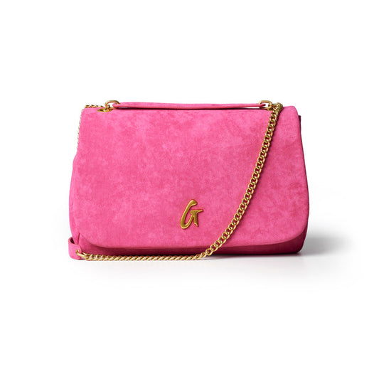 Hot pink medium suede flap bag with a gold chain strap and embossed logo, perfect for stylish everyday use.