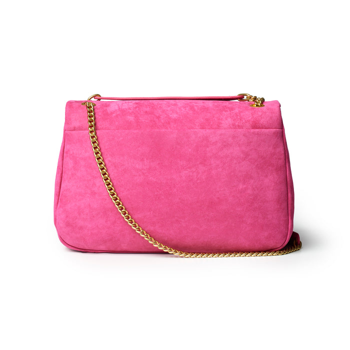 Medium hot pink suede flap bag with a gold chain strap, perfect for adding a pop of color to any outfit.