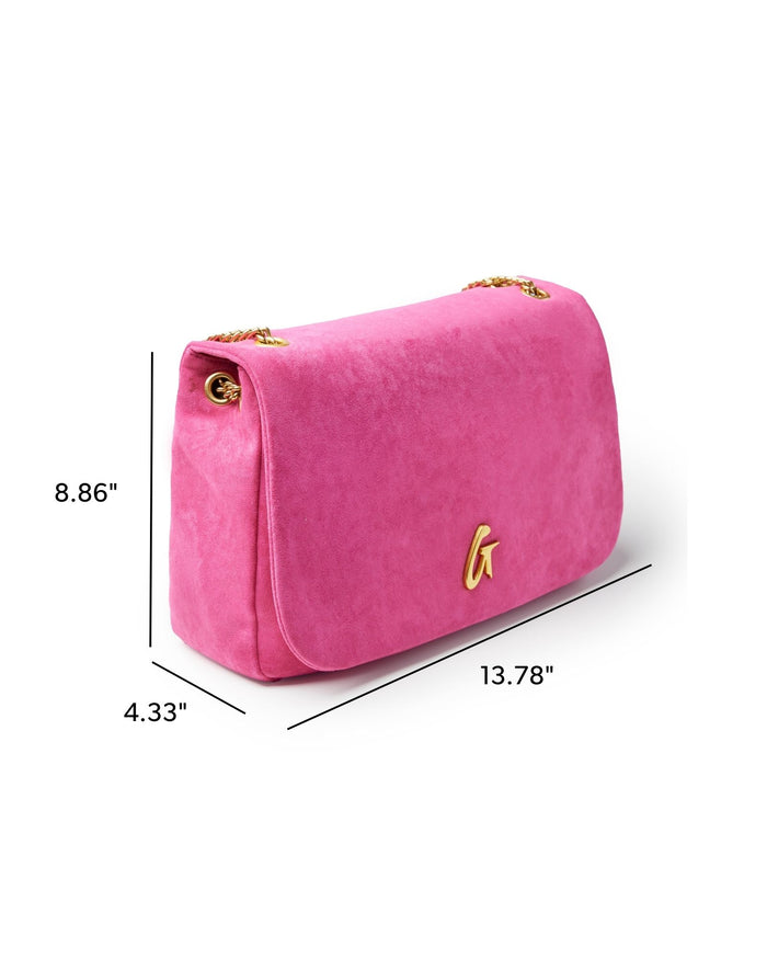 Medium hot pink suede flap bag with gold chain strap and logo detail, perfect for stylish everyday use.