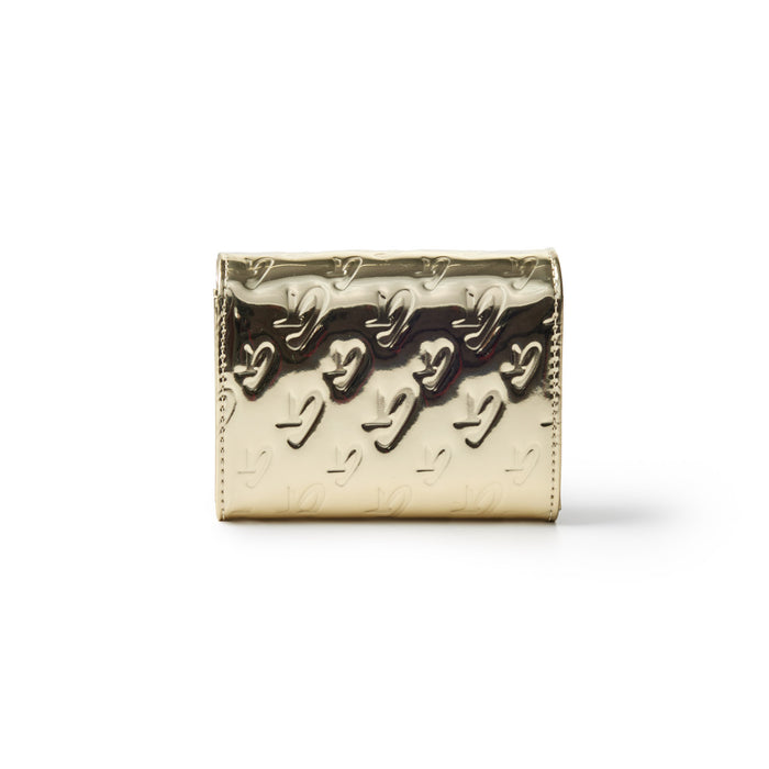 Metallic gold compact wallet with embossed monogram pattern and a shiny, reflective surface.
