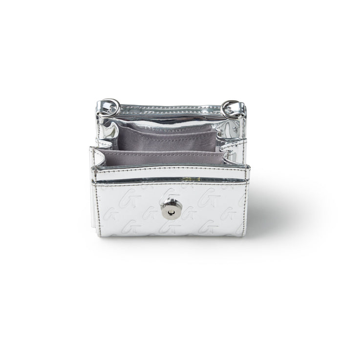 Metallic silver compact wallet with monogram design, multiple card slots, and a snap button closure.