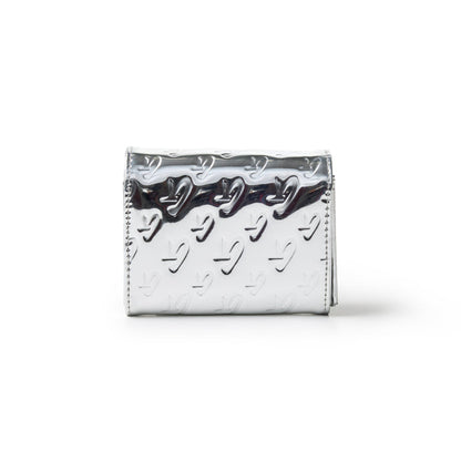 Metallic silver compact wallet with embossed monogram pattern and a shiny, reflective surface.