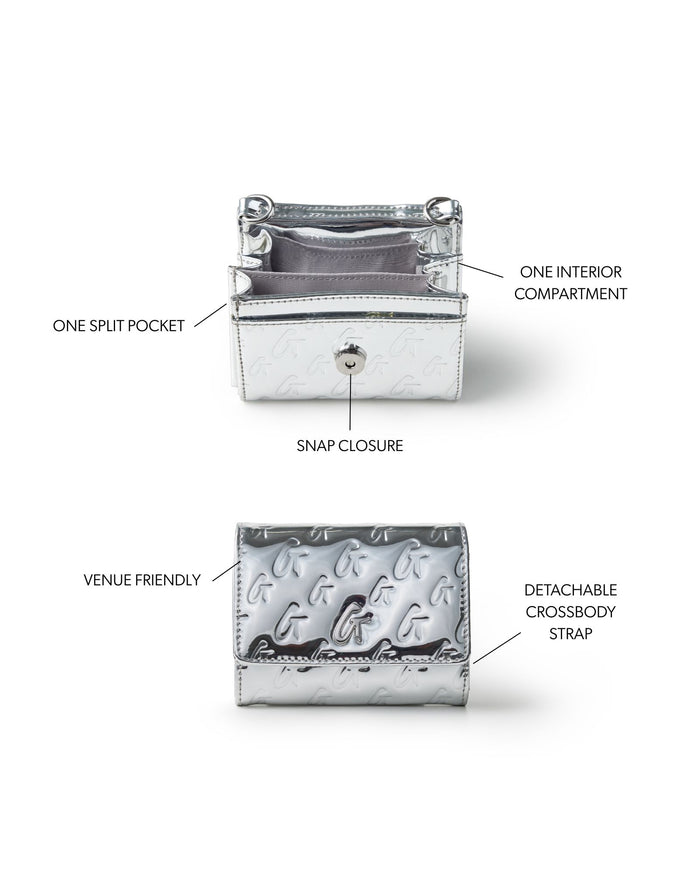 Metallic silver compact wallet on chain featuring a snap closure, one interior compartment, and a detachable crossbody strap.