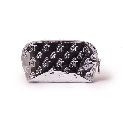 Metallic silver cosmetic pouch with embossed monogram G pattern, shiny finish, and zipper closure.