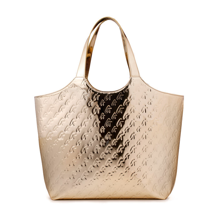 Metallic gold maxi tote bag with embossed monogram pattern and shiny gold handles.