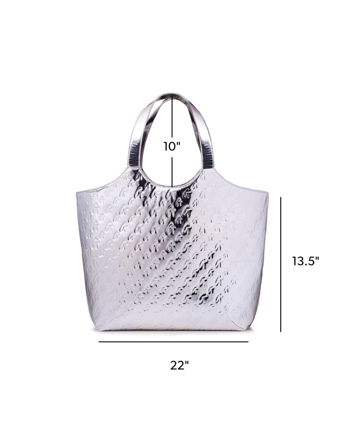 Metallic silver maxi tote with embossed monogram design, featuring sturdy handles and spacious interior.