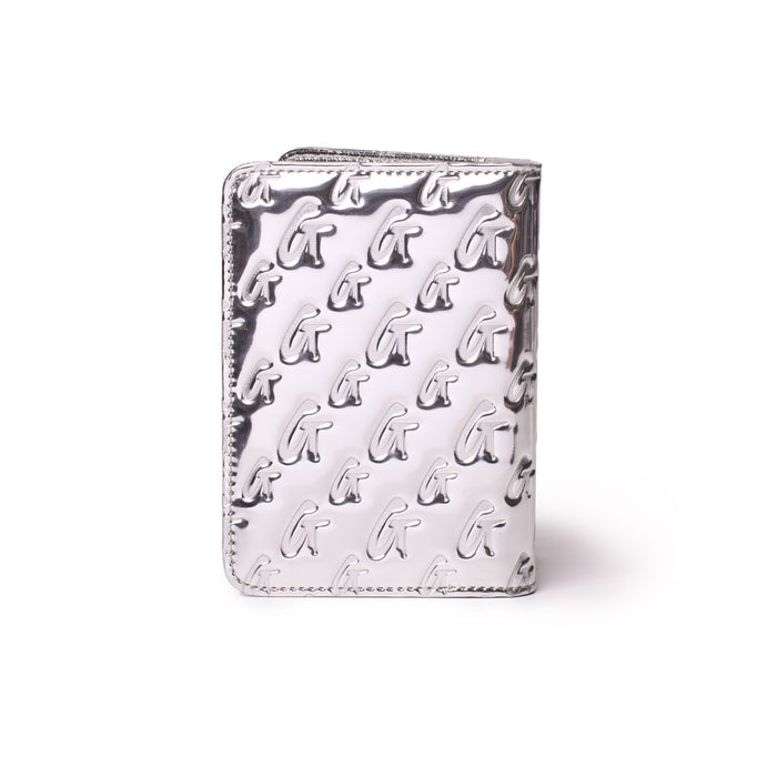 Metallic silver passport holder with a monogram pattern featuring raised "G" initials, sleek and stylish travel accessory.