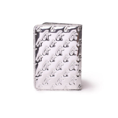 Metallic silver passport holder with a monogram pattern featuring raised "G" initials, sleek and stylish travel accessory.