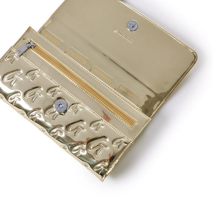 Gold metallic travel wallet with monogram design, featuring labeled compartments for money, tickets, passport, and documents.