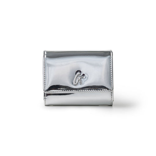 Metallic silver compact wallet with a shiny finish and a small logo emblem on the front.