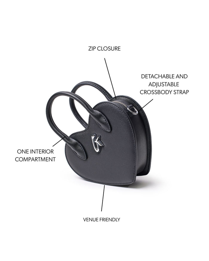 Mini heart-shaped black bag with zip closure, adjustable crossbody strap, and one interior compartment.