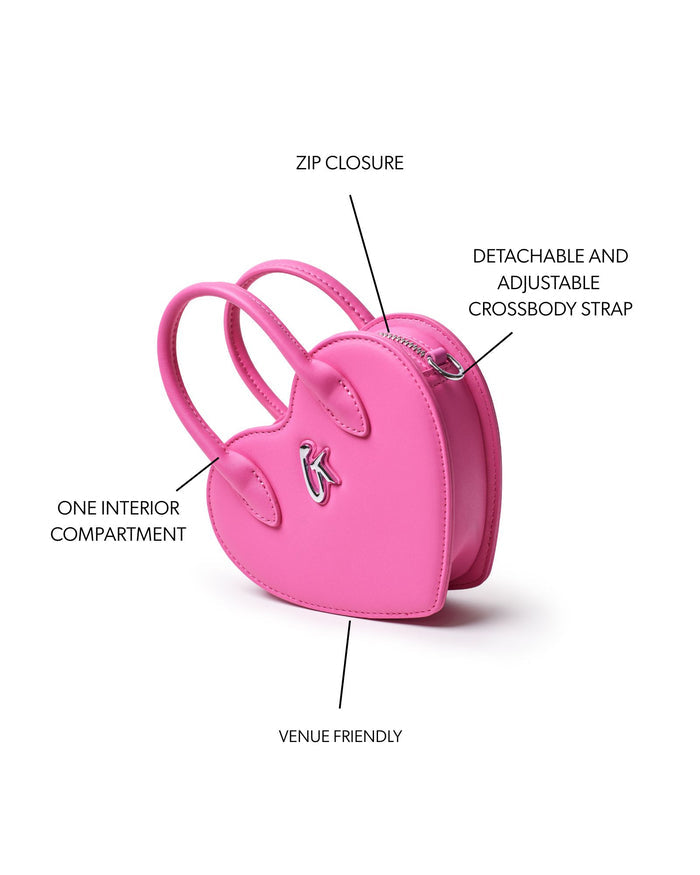 Mini heart-shaped pink bag with zip closure, adjustable crossbody strap, and one interior compartment.