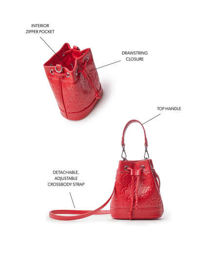 Red mini monogram bucket bag featuring a drawstring closure, top handle, and adjustable crossbody strap.