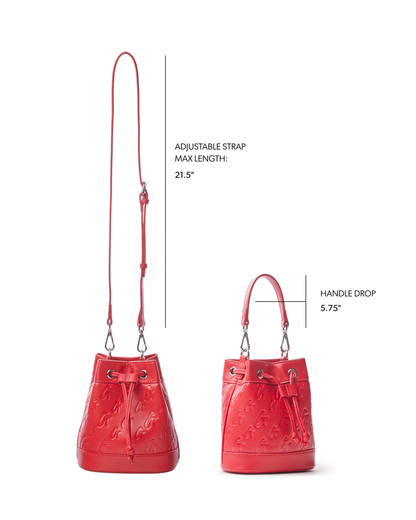 Red mini monogram bucket bag featuring an adjustable strap and a stylish handle drop, perfect for chic everyday use.