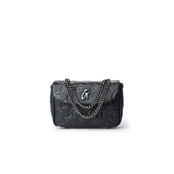 Black mini monogram flap bag featuring a chain strap and embossed logo design, perfect for stylish everyday use.