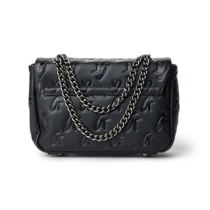 Black mini monogram flap bag with embossed logo pattern and silver chain strap.