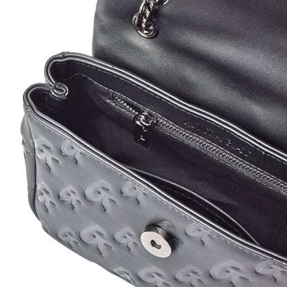 Black mini Monogram Flap Bag with embossed G logo pattern, chain strap, and interior zip pocket.