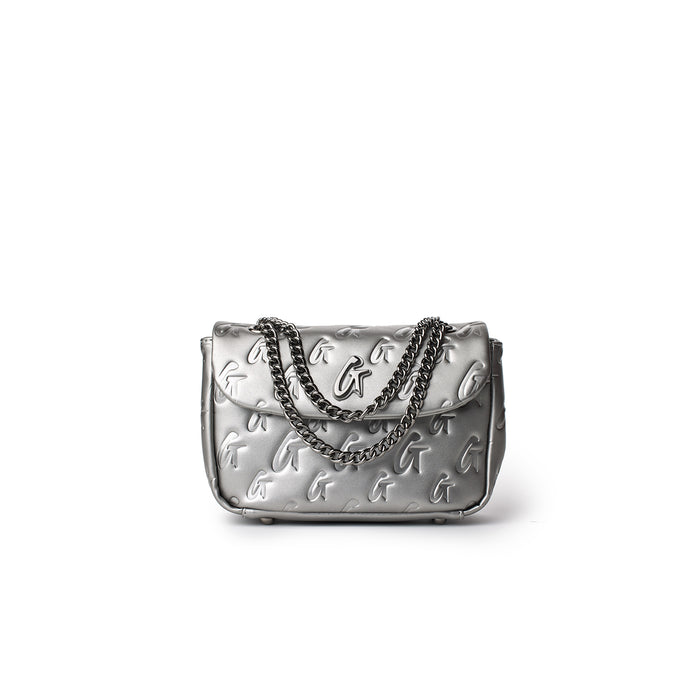 Mini Monogram Flap Bag in platinum with embossed G logo pattern and silver chain strap, stylish and compact accessory.
