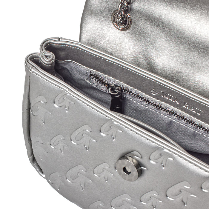 Close-up of a silver MINI Monogram Flap Bag in platinum, featuring embossed logo pattern, interior zip pocket, and chain strap.