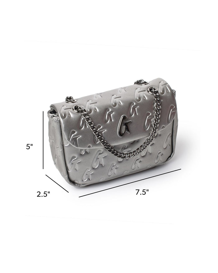 Mini monogram flap bag in platinum with a sleek design and chain strap, perfect for stylish, affordable luxury.