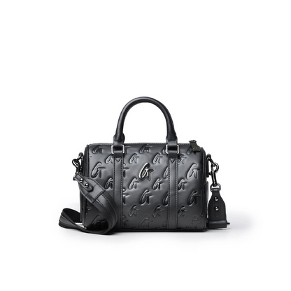 Mini Monogram Gal Boston Bag in black featuring embossed logo design, dual handles, and detachable shoulder strap.