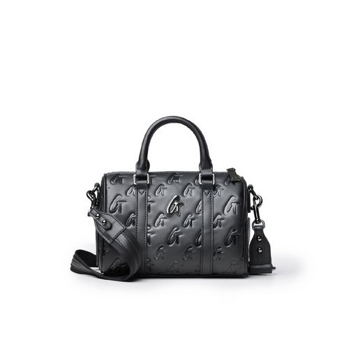 Mini Monogram Gal Boston Bag in black featuring embossed logo design, dual handles, and detachable shoulder strap.