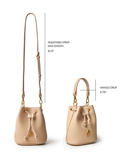 Nude mini pebble bucket bag with adjustable strap and handle drop, showcasing a stylish and versatile design.
