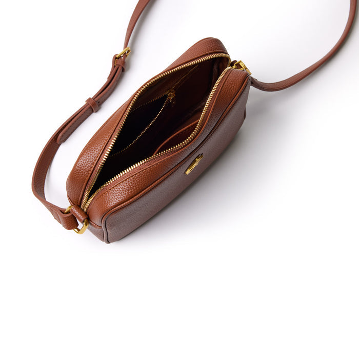 Brown mini pebble leather camera bag with gold zipper, open to show interior compartments, on a white background.