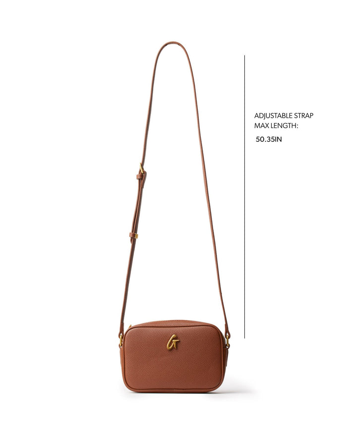 Brown mini pebble camera bag with an adjustable strap, perfect for stylish, everyday use. Ideal for affordable luxury.